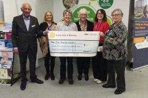 Cheque form the Rotary Club of Bletchley being handed to MK Hospital Charity representatives.